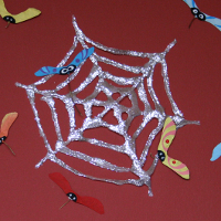 DIY Shiny Halloween spider web - Halloween crafts for toddlers with glue and brocade